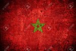 flag of Morocco or Moroccan flag on scratched rough texture
